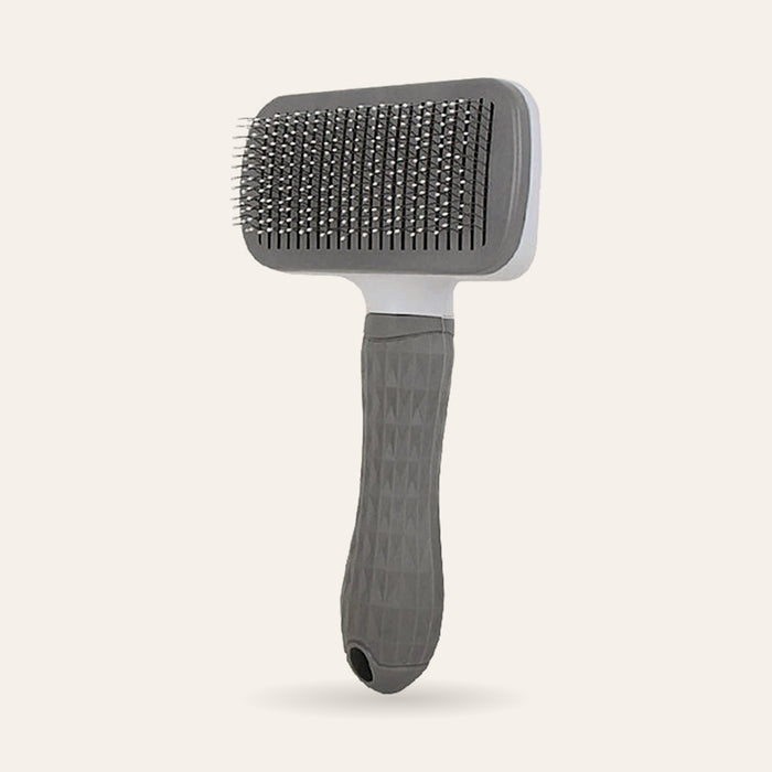 Brosse de toilettage autonettoyante grise