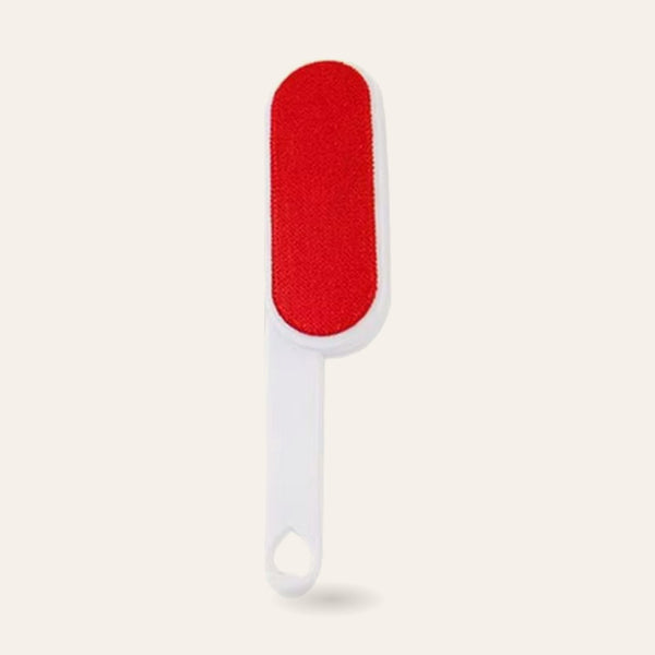 Rouleau anti-poils autonettoyant rouge et blanc sur fond ivoire