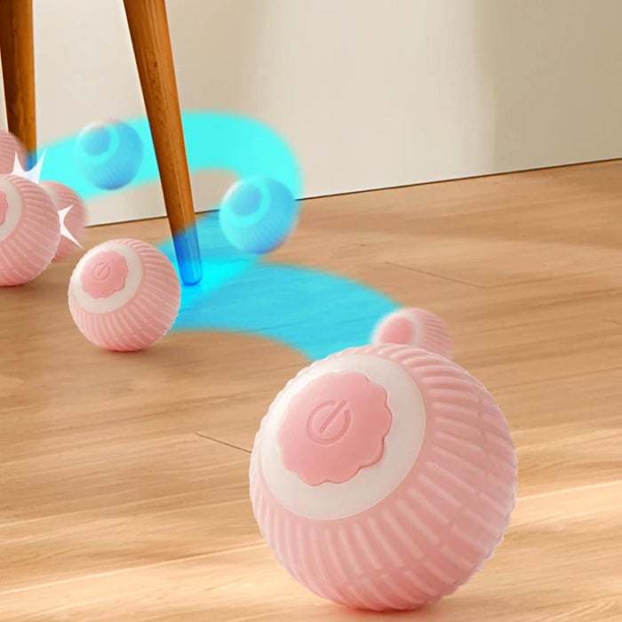 Balle interactive rose en mouvement sur le parquet
